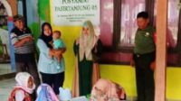 Tingkatkan Pelayanan Posyandu Babinsa Koramil 12 Serangbaru Berikan Pendampingan