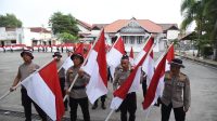 Polres Bireuen Kirab Bendera Merah Putih Sepanjang 100 M